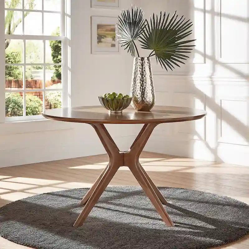 Mesa de comedor redonda de estilo moderno de mediados de siglo con acabado de nogal